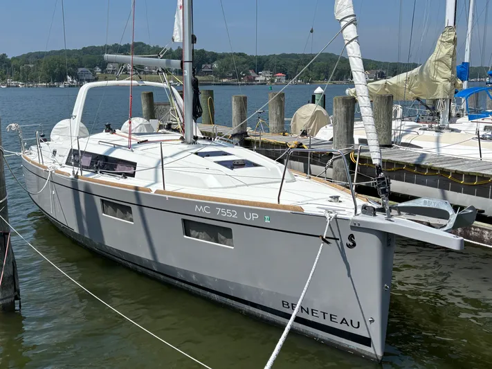 Aveyron Yacht Photos Pics 2021 Beneteau Oceanis 35.1 sailboat docked at a marina, calm waters, clear sky.