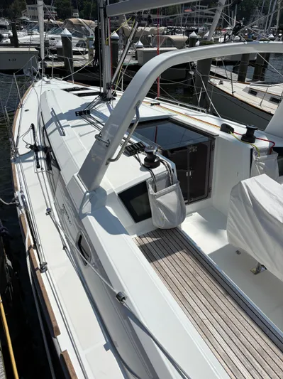 Aveyron Yacht Photos Pics 2021 Beneteau Oceanis 35.1 sailboat docked, showcasing sleek deck design and modern features.