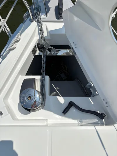 Aveyron Yacht Photos Pics Anchor locker of 2021 Beneteau Oceanis 35.1 sailboat with chain and winch.