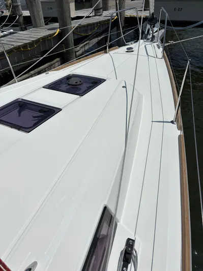 Aveyron Yacht Photos Pics 2021 Beneteau Oceanis 35.1 sailboat deck, docked at marina, showcasing sleek design.