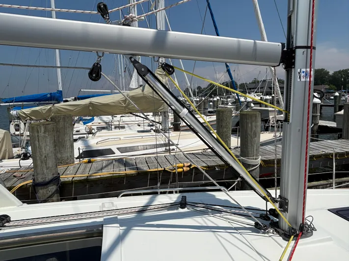 Aveyron Yacht Photos Pics Beneteau Oceanis 35.1 sailboat docked at marina, 2021 model, with visible rigging and mast.