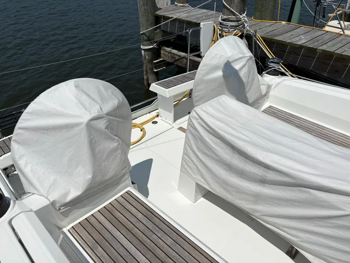 Aveyron Yacht Photos Pics Beneteau Oceanis 35.1 sailboat deck with covered seating, docked at marina.