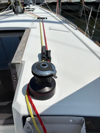 Aveyron Yacht Photos Pics Deck of 2021 Beneteau Oceanis 35.1 sailboat with winch and colorful ropes.