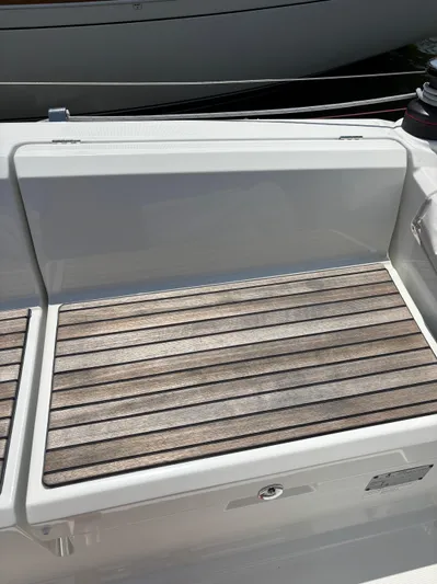 Aveyron Yacht Photos Pics Beneteau Oceanis 35.1 2021 yacht deck with wooden seating area.