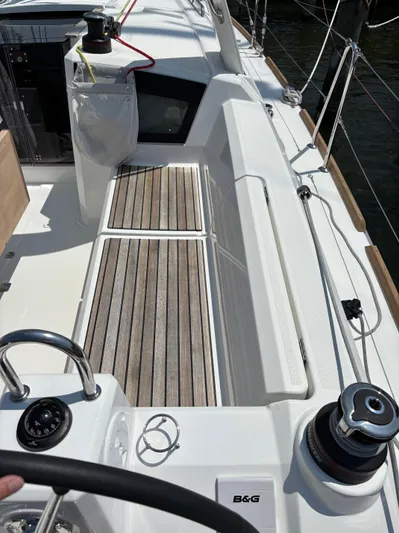 Aveyron Yacht Photos Pics Beneteau Oceanis 35.1 sailboat deck, 2021 model, featuring teak flooring and winch.