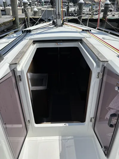 Aveyron Yacht Photos Pics 2021 Beneteau Oceanis 35.1 yacht cabin entrance at a marina.