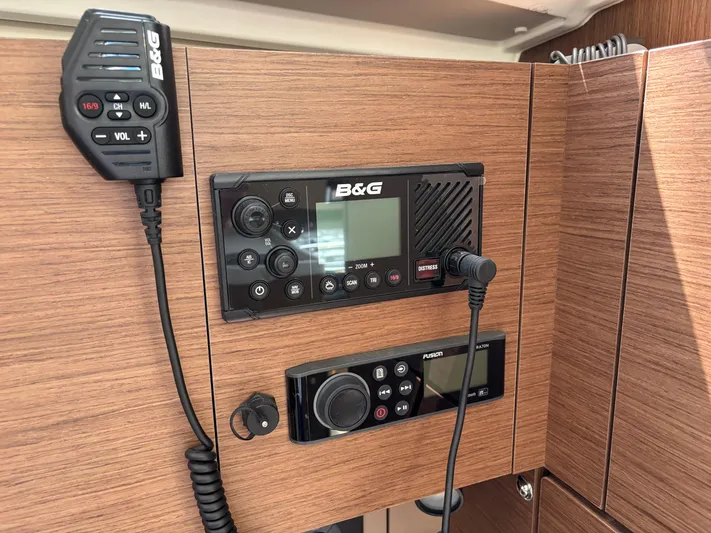 Aveyron Yacht Photos Pics Beneteau Oceanis 35.1 2021 yacht radio and control panel on wooden interior.