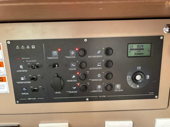 Aveyron Yacht Photos Pics Control panel of a 2021 Beneteau Oceanis 35.1 sailboat, displaying various switches and indicators.