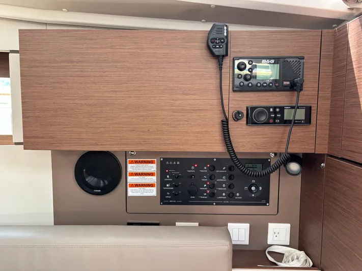 Aveyron Yacht Photos Pics Control panel of a 2021 Beneteau Oceanis 35.1 sailboat with communication equipment.
