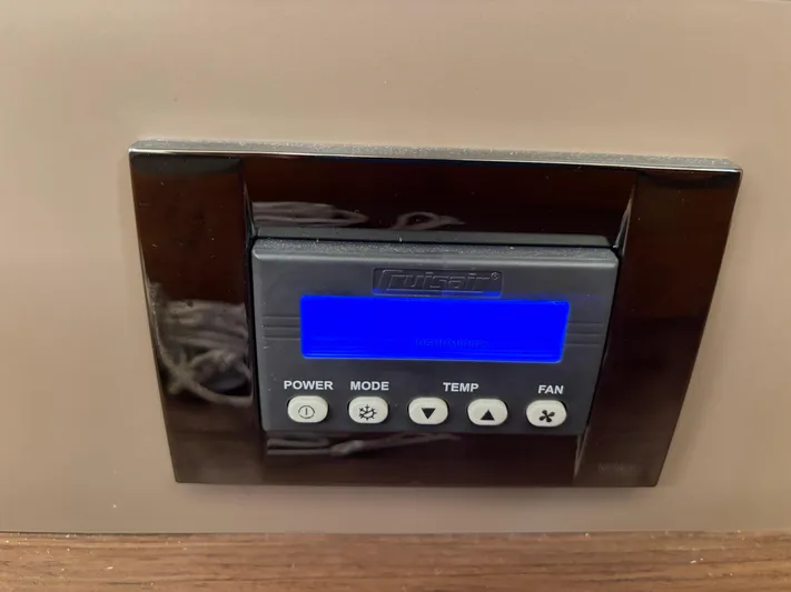 Aveyron Yacht Photos Pics Control panel on a 2021 Beneteau Oceanis 35.1 yacht, featuring power, mode, temperature, and fan settings.