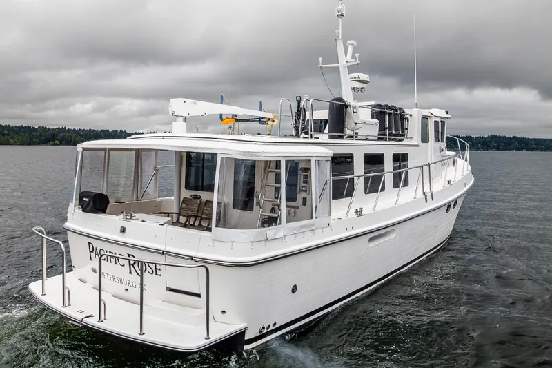 Pacific Rose Yacht Photos Pics 2009 American Tug 49 Limited yacht cruising on a cloudy day.