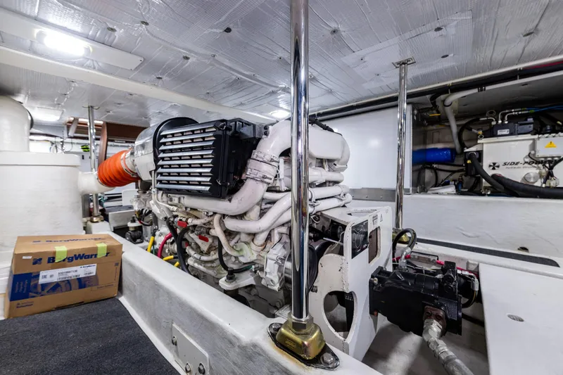 Pacific Rose Yacht Photos Pics Engine room of 2009 American Tug 49 Limited, showcasing machinery and components.