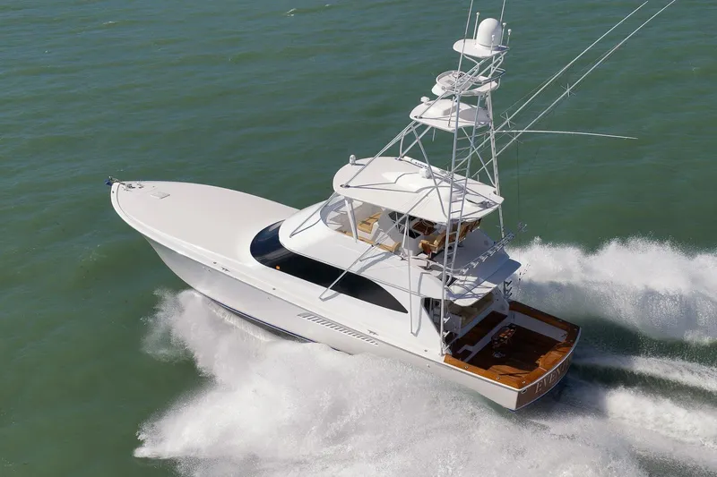 Even Flow Yacht Photos Pics 2009 Viking Convertible yacht cruising swiftly on open water.