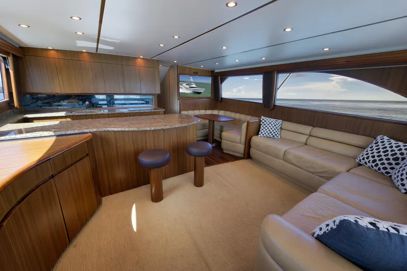 Even Flow Yacht Photos Pics Luxurious interior of 2009 Viking Convertible yacht with elegant wood finishes and ocean view.