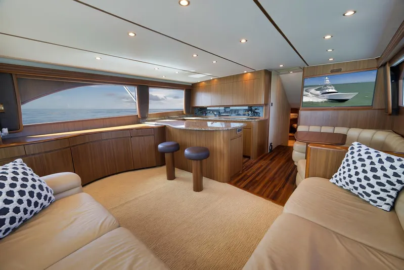 Even Flow Yacht Photos Pics Luxurious interior of a 2009 Viking Convertible yacht with elegant wood finishes and ocean view.