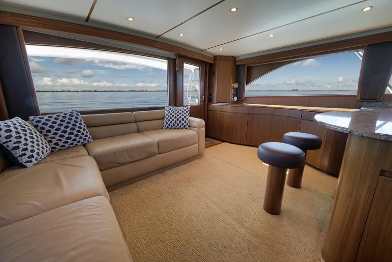 Even Flow Yacht Photos Pics Luxurious interior of a 2009 Viking Convertible yacht with ocean view and elegant furnishings.