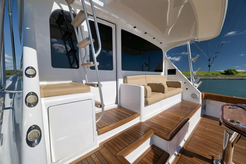 Even Flow Yacht Photos Pics Luxurious 2009 Viking Convertible yacht deck with seating and wooden flooring.