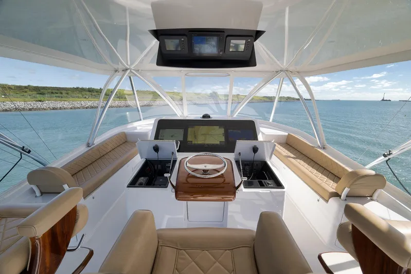 Even Flow Yacht Photos Pics Luxurious 2009 Viking Convertible yacht interior with panoramic ocean view and elegant seating.