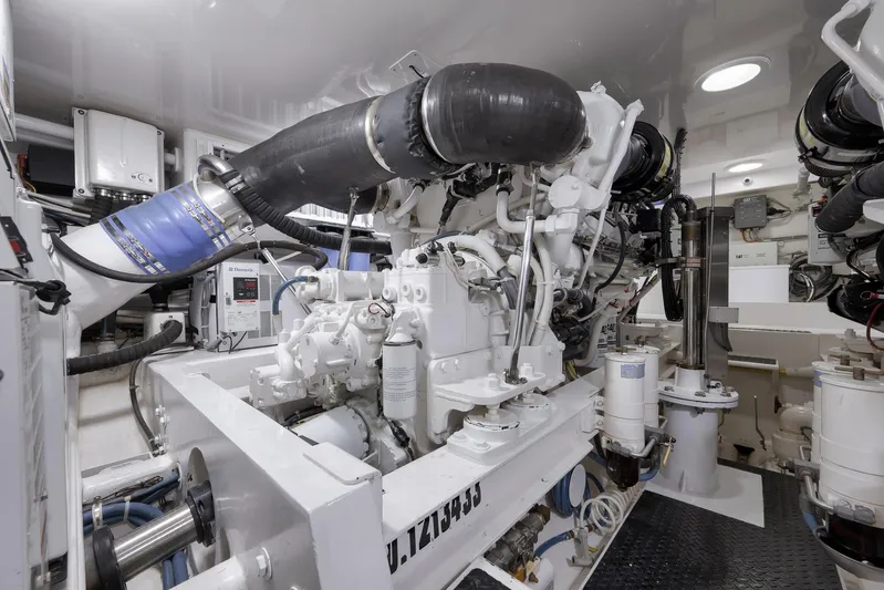 Even Flow Yacht Photos Pics Engine room of a 2009 Viking Convertible yacht, showcasing complex machinery and components.