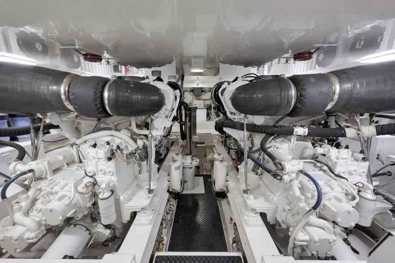 Even Flow Yacht Photos Pics Engine room of a 2009 Viking Convertible yacht, showcasing dual powerful engines.