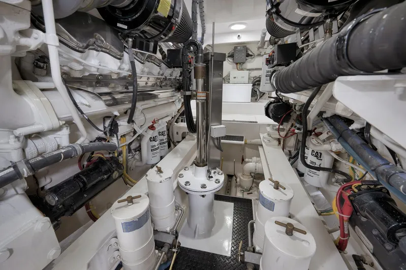 Even Flow Yacht Photos Pics Engine room of a 2009 Viking Convertible yacht, showcasing mechanical components and systems.