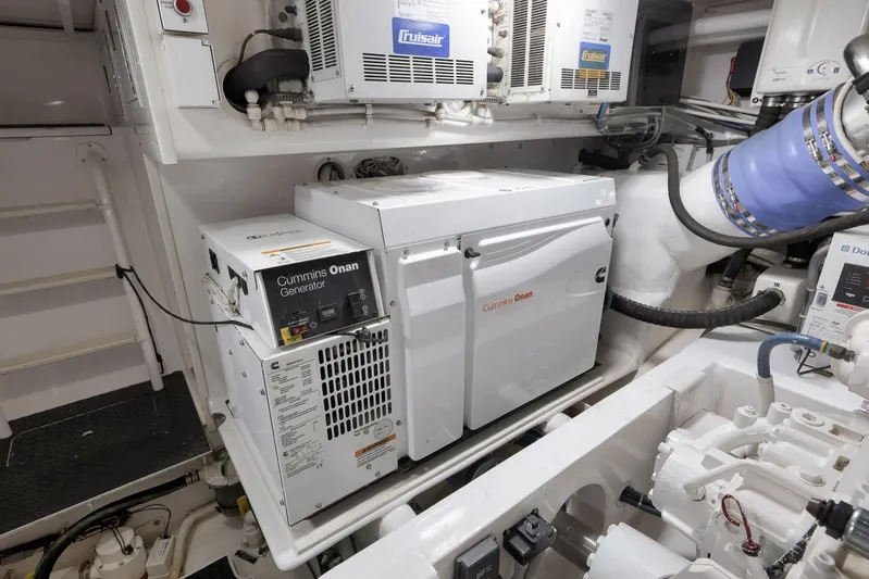 Even Flow Yacht Photos Pics Engine room of 2009 Viking Convertible with Cummins Onan generator and Cruisair system.