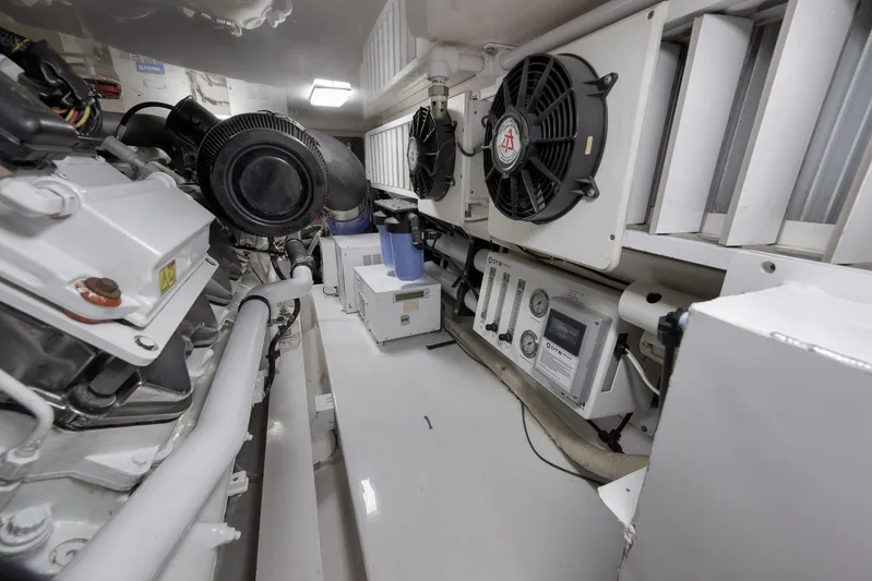 Even Flow Yacht Photos Pics Engine room of a 2009 Viking Convertible yacht, featuring mechanical components and ventilation systems.