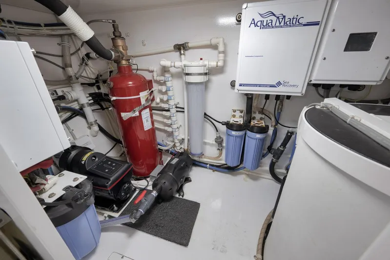 Even Flow Yacht Photos Pics Engine room of 2009 Viking Convertible with AquaMatic water system and fire extinguisher.