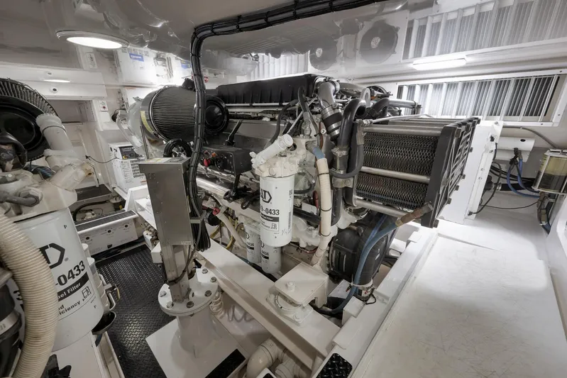 Even Flow Yacht Photos Pics Engine room of a 2009 Viking Convertible yacht, showcasing detailed machinery and components.