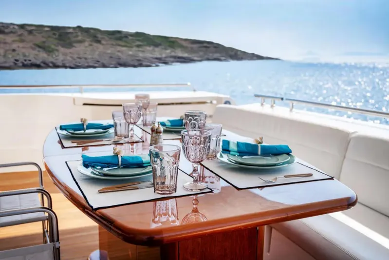  Yacht Photos Pics Elegant dining setup on 2003 Ferretti Yachts 760, overlooking serene ocean view.