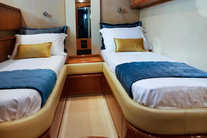  Yacht Photos Pics Luxurious twin cabin interior of 2003 Ferretti Yachts 760 with elegant bedding.