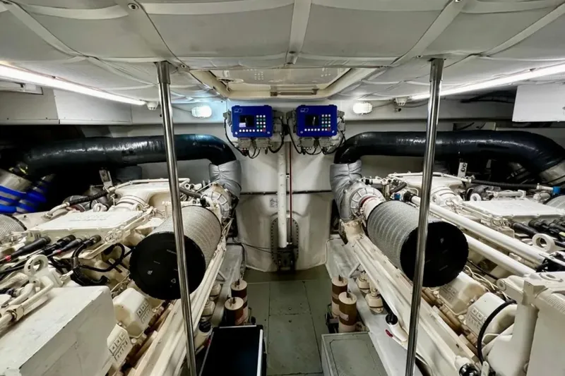  Yacht Photos Pics Engine room of a 2003 Ferretti Yachts 760, showcasing dual engines and control systems.