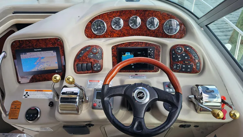 Sea Jazz Yacht Photos Pics 2007 Sea Ray 340 Sundancer helm with navigation screens and controls.