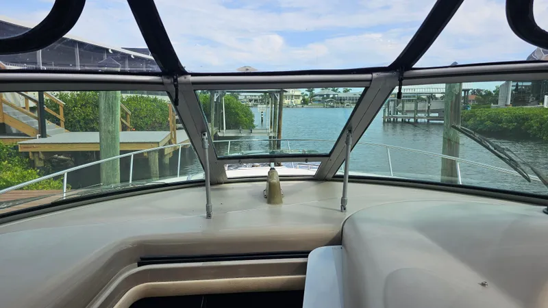 Sea Jazz Yacht Photos Pics 2007 Sea Ray 340 Sundancer cockpit view with marina backdrop.