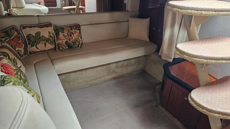 Sea Jazz Yacht Photos Pics Interior of 2007 Sea Ray 340 Sundancer with beige seating and floral cushions.