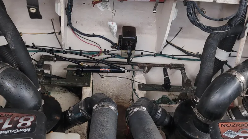 Sea Jazz Yacht Photos Pics Engine compartment of a 2007 Sea Ray 340 Sundancer with visible hoses and wiring.