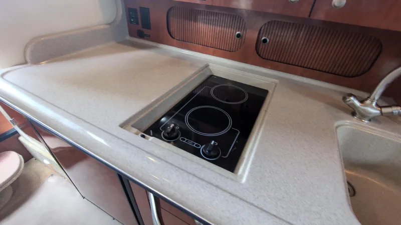 Sea Jazz Yacht Photos Pics 2007 Sea Ray 340 Sundancer kitchen with electric stove and sink.