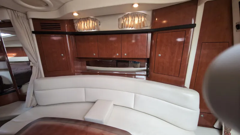 Sea Jazz Yacht Photos Pics Luxurious interior of 2007 Sea Ray 340 Sundancer with elegant wood cabinetry and plush seating.