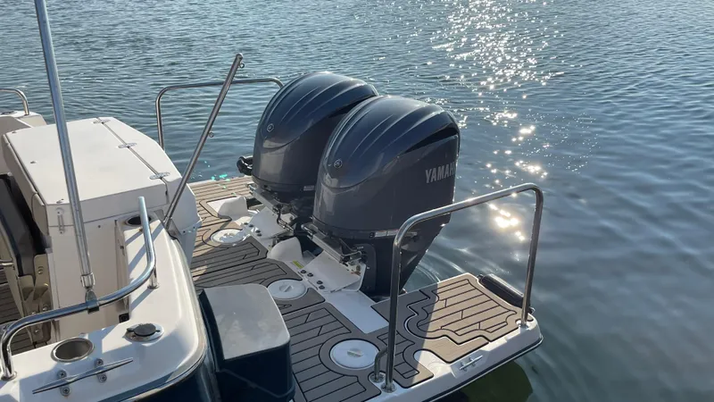  Yacht Photos Pics 2022 Cutwater C-32 Sedan with dual Yamaha outboard engines on a sunny day.