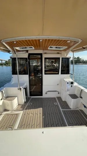  Yacht Photos Pics 2022 Cutwater C-32 Sedan boat with spacious deck and modern design on the water.