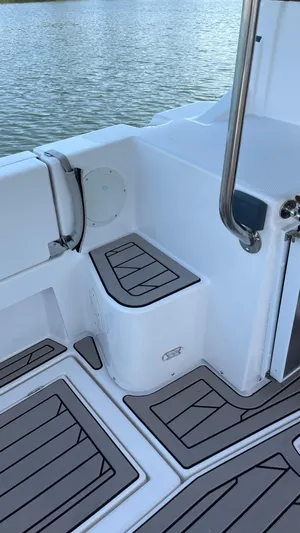  Yacht Photos Pics 2022 Cutwater C-32 Sedan boat deck with sleek seating and water view.