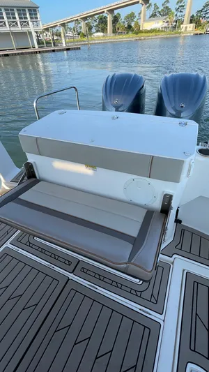  Yacht Photos Pics 2022 Cutwater C-32 Sedan boat with dual engines and seating, docked by the water.