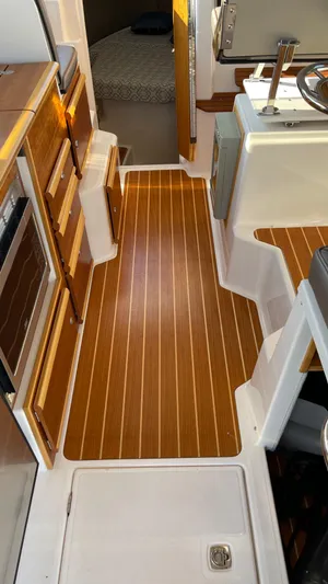  Yacht Photos Pics Interior view of 2022 Cutwater C-32 Sedan with wood flooring and modern amenities.