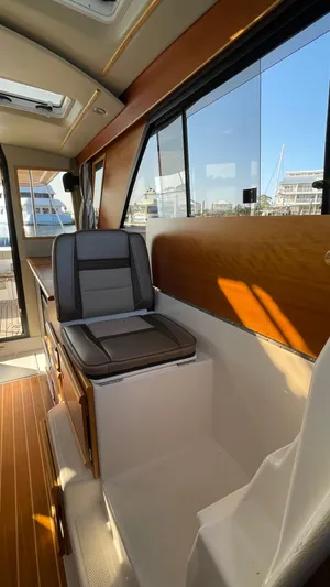  Yacht Photos Pics 2022 Cutwater C-32 Sedan interior with seating and large windows.