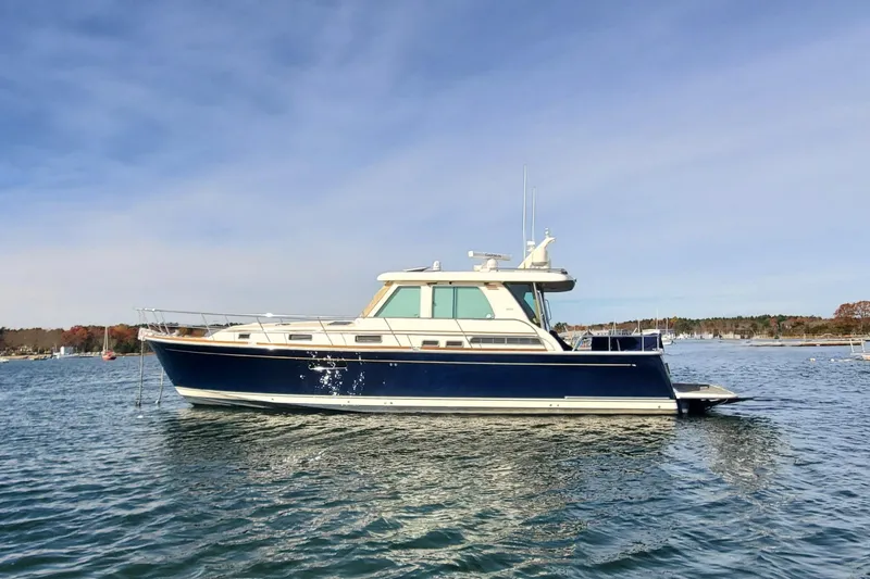 Brio Yacht Photos Pics 2012 Sabre 48 Salon Express yacht on calm water under clear sky.