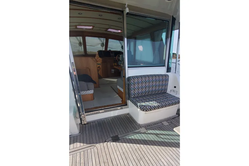 Brio Yacht Photos Pics 2012 Sabre 48 Salon Express interior with seating and helm view.