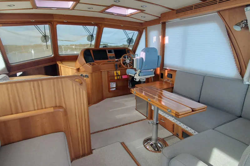 Brio Yacht Photos Pics Luxurious interior of 2012 Sabre 48 Salon Express yacht with helm and seating area.