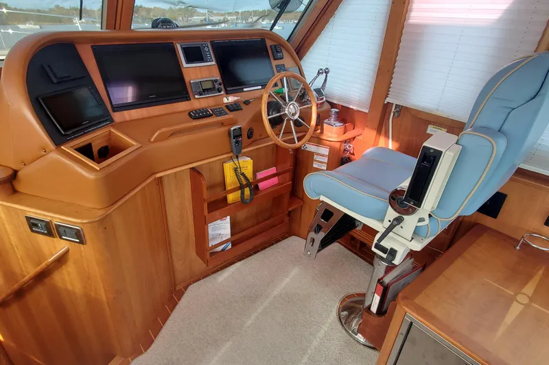 Brio Yacht Photos Pics Interior helm of 2012 Sabre 48 Salon Express with navigation equipment and captain's chair.