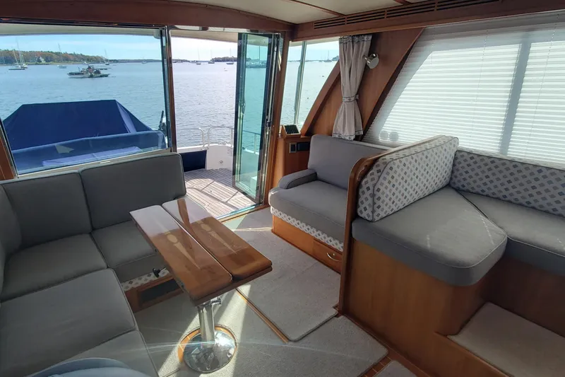 Brio Yacht Photos Pics Interior of 2012 Sabre 48 Salon Express yacht with elegant seating and scenic water view.