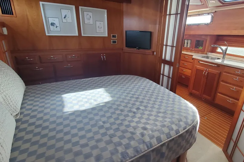 Brio Yacht Photos Pics Luxurious 2012 Sabre 48 Salon Express interior with cozy bedroom and elegant wood finishes.